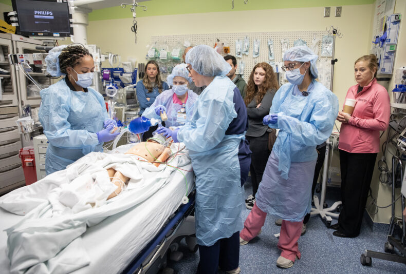 The Be In The Zone program included a daylong event where students experienced a mock trauma simulation in the ED. (photo by Erin O. Smith)
