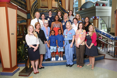 The pediatric liver transplant team gathered for a photo during Antwane Cole Jr.’s recent followup visit. (photo by John Russell)