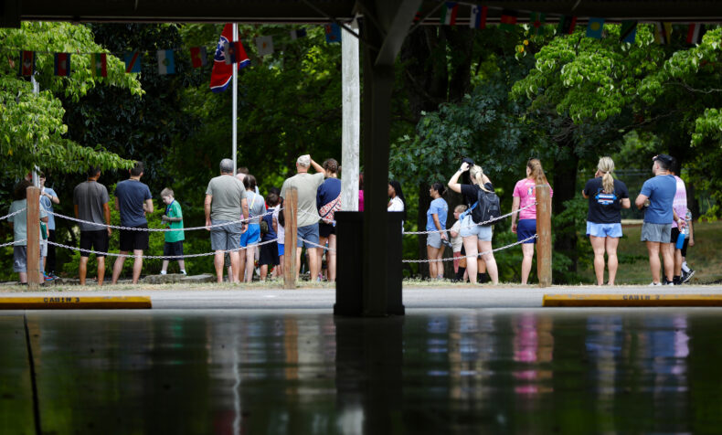 Campers and counselors attend the morning flag raising session at Camp Hope. (photo by Donn Jones)