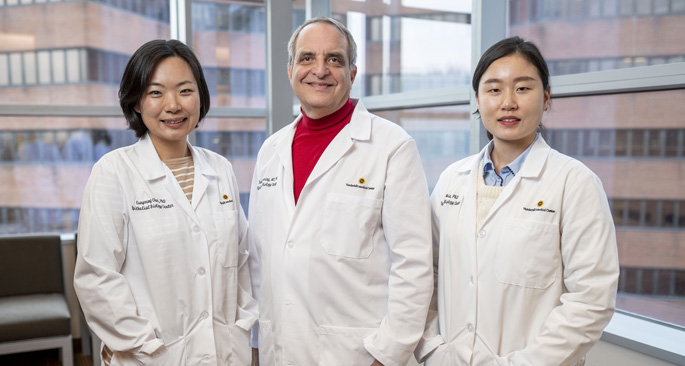 A new grant is helping Eunyoung Choi, PhD, left, James Goldenring, MD, PhD, Jimin Min, PhD, and colleagues around the globe to study inflammation-related cancers.