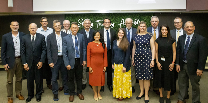 Award winners and faculty pose for a photo before last week’s School of Medicine Spring Faculty Meeting.
