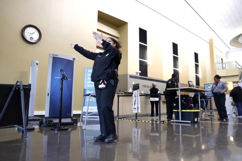 Ivette Yates, weapons detection safety officer, helps guide visitors through the correct door as new security features were rolled out at Vanderbilt Health One Hundred Oaks in March. (photo by Donn Jones)