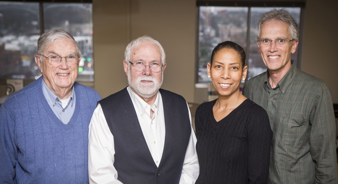 Anderson Spickard Jr., MD, left, William Swiggart, MS, Charlene Dewey, MD, MEd, and Ron Neufeld, BSW, LADAC, stand on the 11th floor of the Oxford House, where the Center for Professional Health was launched in 1987.