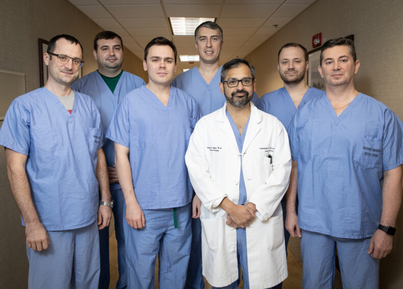 Vanderbilt’s Ashish Shah, MD (in white coat); with Ukrainian physicians, from left, Roman Buriak, MD, PhD; Vadym Mykolaienko, MD; Maksym Konodiuk, MD; Oleg Zhurba, MD, PhD; Yevhen Yarmilko, MD; and Vadym Golub, MD. (photo by Erin O. Smith)