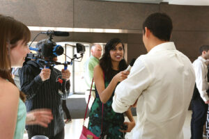 Pasricha interviews a classmate during the Match Day festivities. “Match tells you where you are going to be, not who you are going to be,” she says. Photo by Anne Rayner.