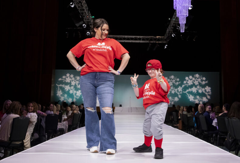 Blake Kirby walks the runway with his sister, April. (photo by Susan Urmy)