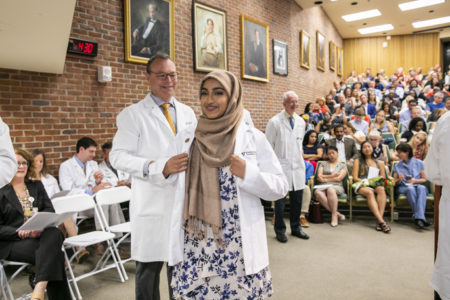 Bushra Rahman smiles after receiving her coat.