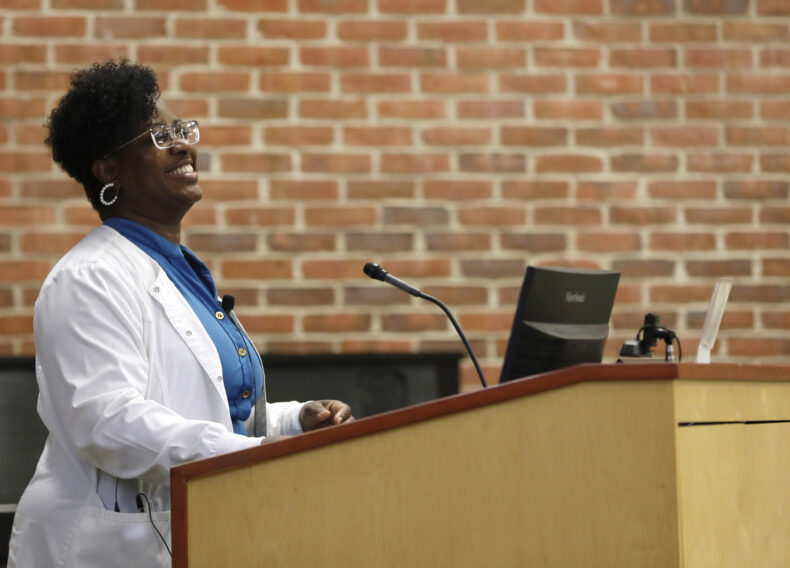 Andrea Poynter, PhD, MSN, RN, executive director of Nurses Middle College Nashville, speaks during the recent spring Nursing Grand Rounds at VUMC. (photo by Donn Jones)