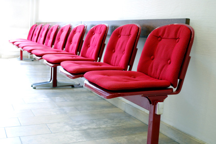 red seats in a row in a waiting room
