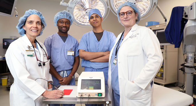 Carmen Solórzano, MD, left, Emmanuel Mannoh, Giju Thomas, PhD, Naira Baregamian, MD, and colleagues are testing a device to assist in locating parathyroid glands during surgery.