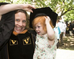 School of Nursing graduate Amy Nassar gets a little help before the ceremony from her daughter, Janis. (photo by Susan Urmy)