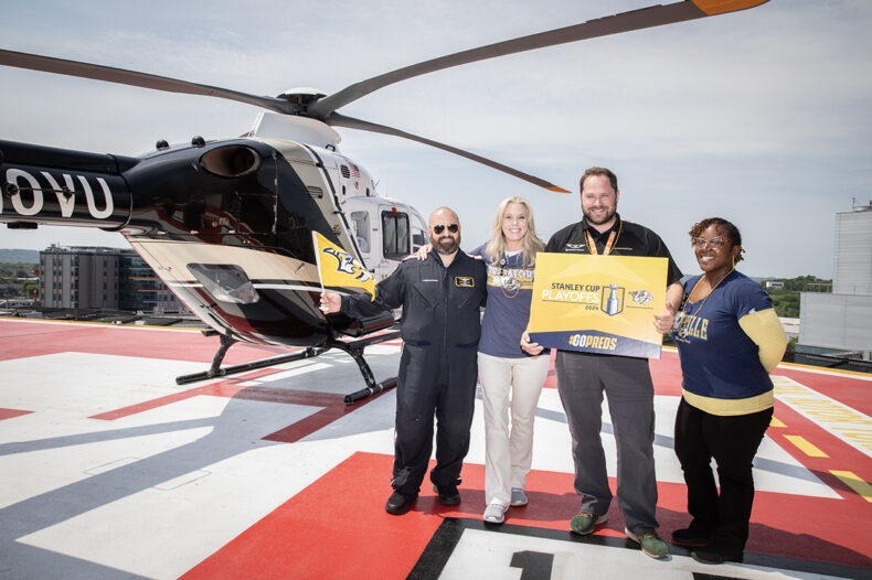 Showing their pride on the LifeFlight helipad were Beau Nicholson, Laura Price, RN, MSN, Cyrenthia Arthur and Eric Massey, EMT. (photo by Erin O. Smith)