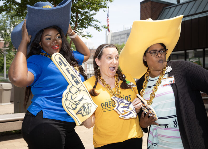 Felicia Wreh, left, with Deb Dixon and Stacy Roberson. (photo by Erin O. Smith)