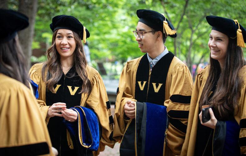 Brandie Taylor, PhD (Cancer Biology), left, Nathaniel Tran, PhD (Health Policy and Services Research) and Kimberly Thibeault, PhD (Neuroscience), wait for the Graduate School commencement ceremony to begin. (photo by Erin O. Smith)