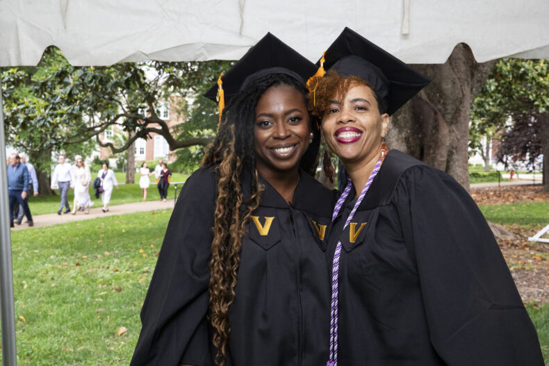 Danielle Farley, left, and Nicole Arrington prior to the School of Nursing ceremony. (photo by Susan Urmy)
