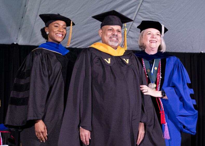 FNP graduate Shawkat Youssef Shehatal with Julia Steed, left, PhD, APRN, and Mavis Schorn, PhD, CNM. (photo by Susan Urmy)
