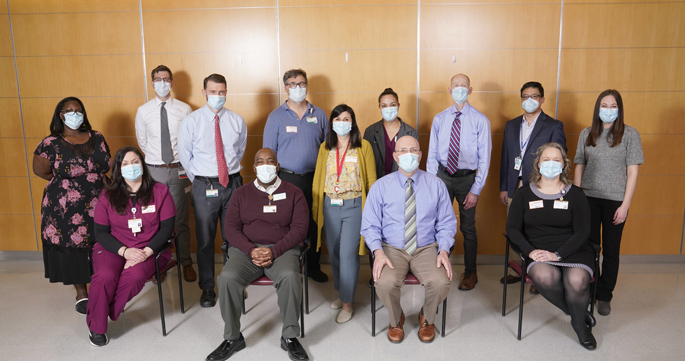 The study team includes (seated, from left) Adrienne Baughman, CCRP; Bob McClellan; Wesley Self, MD, MPH; Christina Kampe, CCRP; (standing, from left) Rendie McHenry; Bo Stubblefield, MD; Jon Casey, MD, MSCI; Todd Rice, MD, MSc; Natasha Halasa, MD, MPH; Jakea Johnson, MPH; Jim Chappell, MD, PhD; Carlos Grijalva, MD, MPH; and Kelsey Womack, PhD. Not pictured are Julia Rhoads, PhD; Chris Lindsell, PhD; Keipp Talbot; MD, MPH; and Kimberly Hart, MA. (photo by Donn Jones)