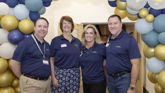 From left, Adam Seegmiller, MD, PhD, vice chair for Clinical Affairs in the Department of Pathology, Microbiology and Immunology and executive medical director of Pathology and Laboratory Medicine – Clinical Service Center; Alice Coogan, MD, chair of the Department of Pathology, Microbiology and Immunology; Victoria Laughman, vice president of Business Development for Laboratory Services; and David Vinson, senior vice president of Diagnostic Laboratory Services, were some of the leaders on hand to greet more than 400 visitors and answer questions during an open house at the Medical Center’s new laboratory space at Metro Center. (all photos by Donn Jones)