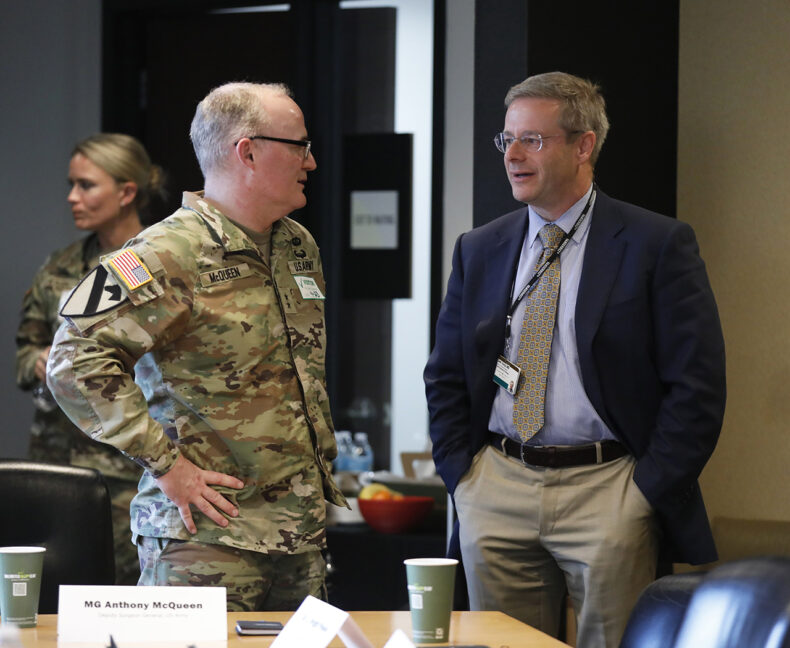 Seth Karp, MD, chair of the Section of Surgical Sciences, H. William Scott Jr. Chair in Surgery and surgeon-in-chief for VUMC, speaks with McQueen. (Photo by Donn Jones)
