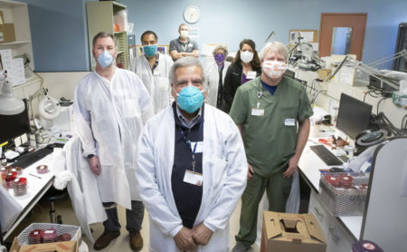 Howard Price, in front, with some of the team that worked to create viral transport media for COVID-19 testing, including (from left) Sean Benner, Bruce Abram, Edie Sannella, Sharon Glover, Trey Malone and (in back) Jonathan Schmitz.