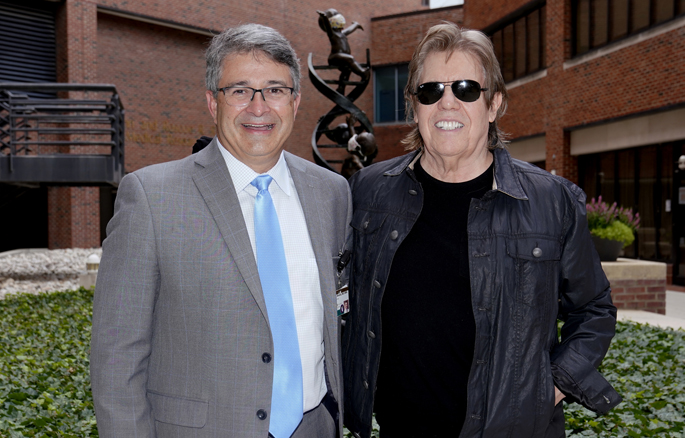 Rocker George Thorogood, right, shown here with Ronald Alvarez, MD, MBA, recently made a donation to Vanderbilt-Ingram Cancer Center (VICC) from the Marla Thorogood Memorial Fund for Ovarian Cancer Research and plans to do more in memory of his wife, Marla, who he lost to ovarian cancer in 2019. In September, a limited-edition T-shirt featuring the Destroyers logo will be available for purchase online and at shows during the “Good to Be Bad Tour.” Sales will benefit cancer research at VICC.