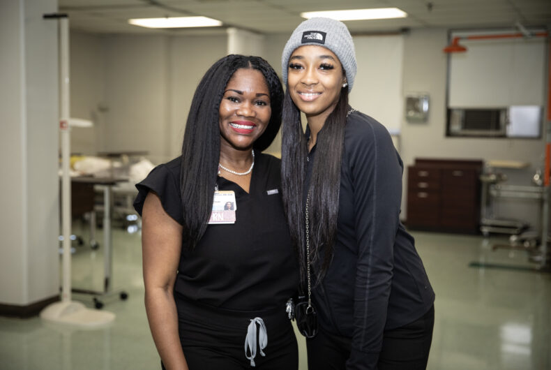 As a mentor VUMC nurse Ebony Israel-Grover, RN, left, shares her own health care journey and advice with Pearl-Cohn High School sophomore Lamya Robertson. (photo by Erin O. Smith)