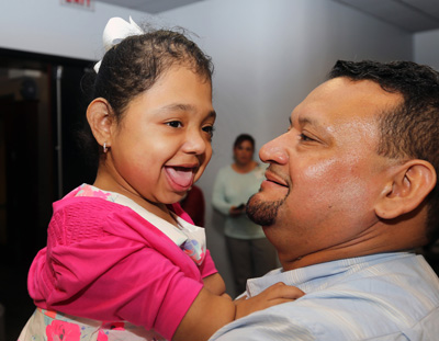 Rare bone disorder patient Janelly Martinez-Amador hugs her father, Salvador Martinez, during a follow-up visit to Monroe Carell Jr. Children’s Hospital at Vanderbilt. (photo by Steve Green)