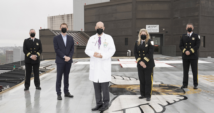 On the LifeFlight helipad are, from left, Kevin Nooner, MSN, RN, NE-BC, Airbus Helicopters’ Romain Trapp, Stephan Russ, MD, Jeanne Yeatman, MBA, RN, EMT, MOM, and Michael Wallace, MBA, CCPM, NRP.