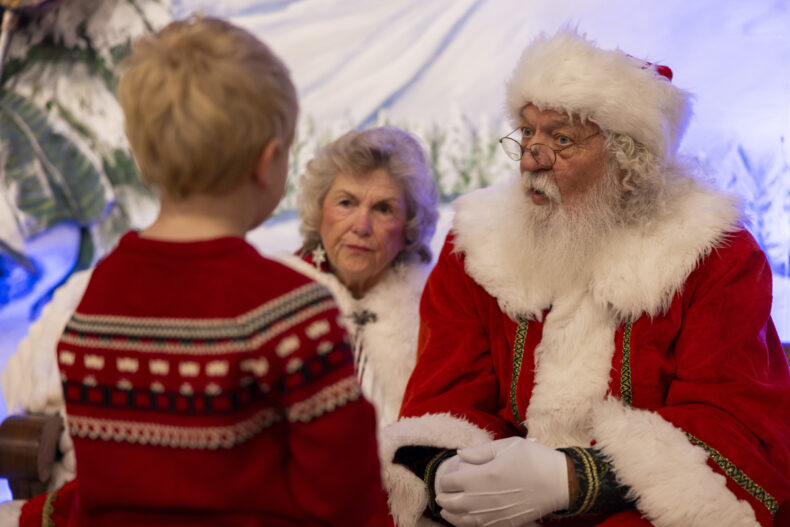 Santa and Mrs. Claus ponder five-year-old Jackson Ferguson's question during a visit to Monroe Carell Jr. Children's Hospital at Vanderbilt. (photo by Erin O. Smith)
