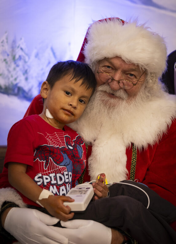 Alan Tecu, 4, poses with Santa during a recent visit to Monroe Carell Jr. Children's Hospital at Vanderbilt on Dec. 12. (photo by Erin O. Smith)