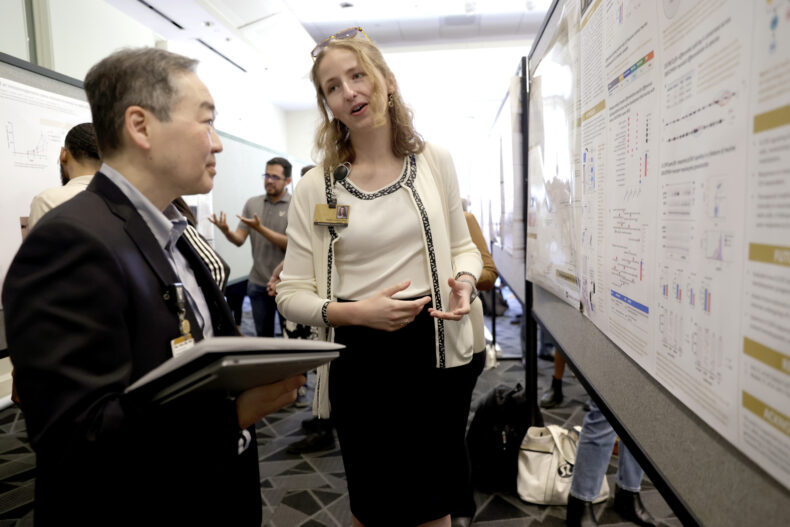 Abigail Lindsey Rich talks about her research poster with Vanderbilt-Ingram Cancer Center director Ben Ho Park, MD, PhD. (photo by Donn Jones)