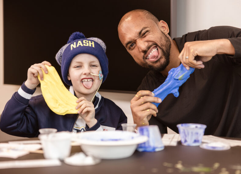 Patient Isla Johnston goofs around with Nashville Soccer forward Club Teal Bunbury at Monroe Carell Jr. Children’s Hospital at Vanderbilt. (photo by Angelea Yoder)
