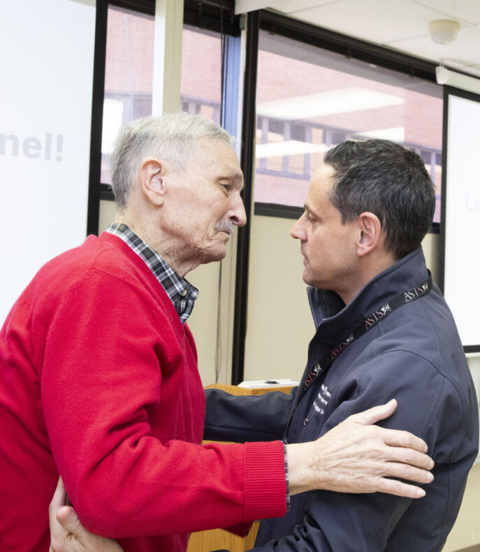 Martin Montenovo, MD, right, shares a big hug with his former patient, Will Gordon, a two-time liver transplant recipient. (photo by Susan Urmy)