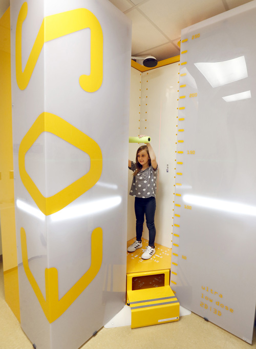 Chloie Jacobs demonstrates the new X-ray imaging device at Monroe Carell Jr. Children’s Hospital at Vanderbilt that uses ultra-low radiation doses.