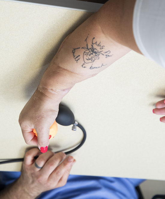 Dawn Reed’s new tattoo is intentionally placed where a free flap surgery performed by Vanderbilt University Medical Center plastic surgeons saved her arm from amputation. (photo by Susan Urmy)