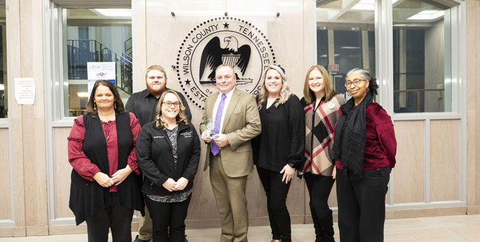 Scot McCarver, MHA, center, with, from left, LeAnn Allen, Hunter Clark, (in back), Michelle Elmore, Kylie Pitman, Kendal Bourke, and Debbie Winfree-Jennings. (photo by Susan Urmy)