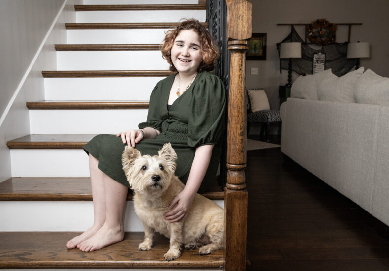 Maddie Wright with her service dog, Quip. (photo by Erin O. Smith)