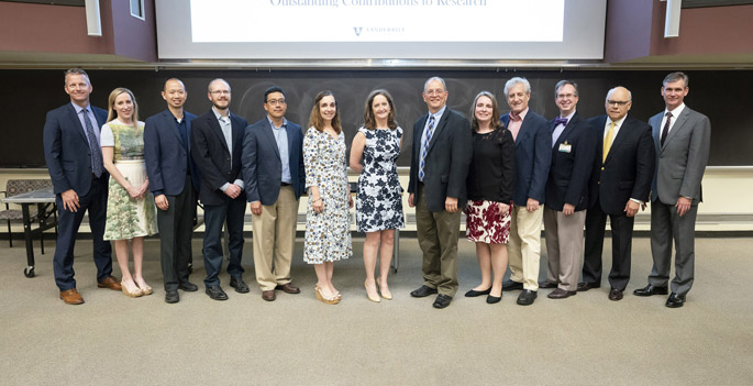 Award winners pose for a photo at last week’s Spring Faculty Meeting.