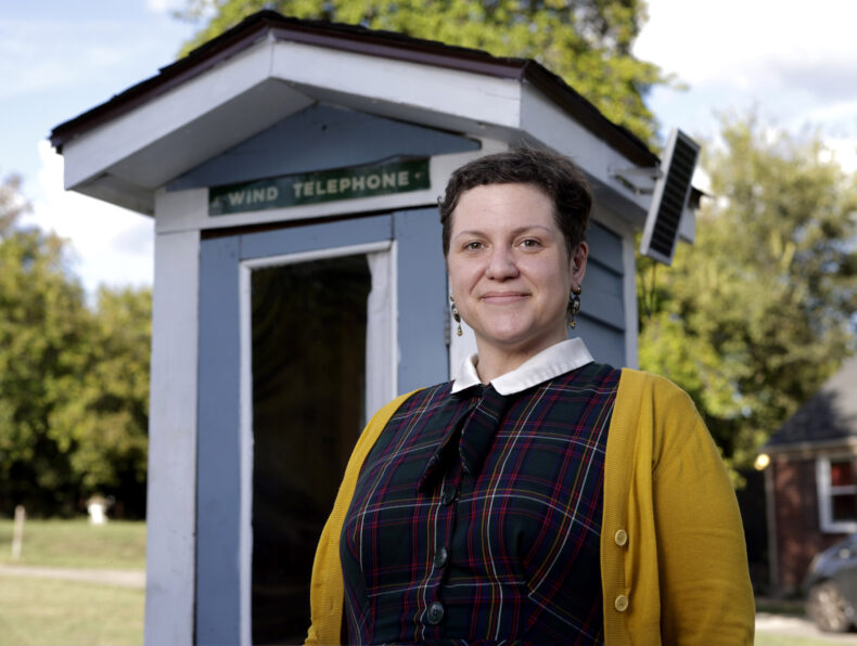 Vanderbilt nurse Allison Young, MS, BSN, RN, outside the “wind phone” booth at her home. (photo by Donn Jones)