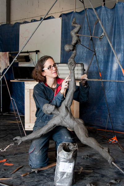 Briony Marshall working on “Barton's Chair,” a commission for a school science building. Marshall transforms the chair isomer, a configuration of the cyclohexane molecule modeled by English organic chemist and Nobel laureate Sir Derek Barton, into a dance of interconnected human forms, bridging the worlds of science and art. 