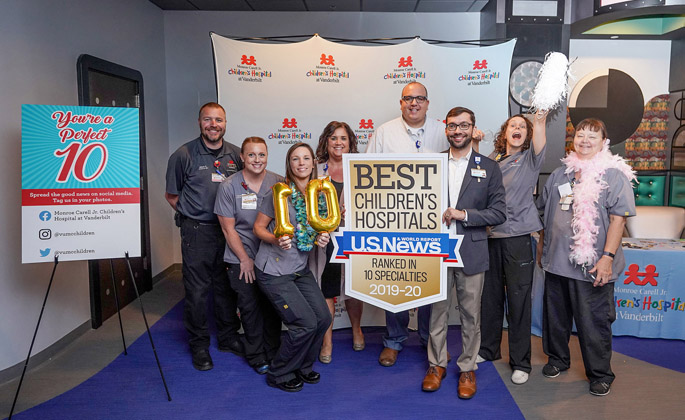 Monroe Carell Jr. Children’s Hospital at Vanderbilt staff gathered recently to celebrate the hospital’s performance in the recent U.S. News & World Report ranking of America’s Best Children’s Hospitals. For the 13th consecutive year, Children’s Hospital was named among the nation’s leaders in pediatric health care by the magazine in its annual ranking released in June. Children’s Hospital once again achieved a maximum of 10 out of 10 pediatric specialty programs to be nationally ranked. Pictured: the Neonatal and Pediatric Transport team takes a group picture at the celebration photo booth.