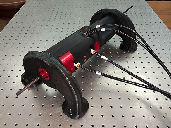 Robot resembling a large drill mounted on a platform