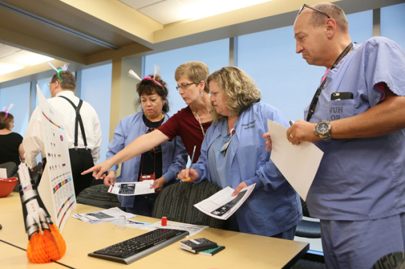 From left, Alicia Gomez, R.N., Janie Stone, Kerri Wilson, MSN, R.N., and Leslie Wilkes visit the EpicLeap informational ‘Space Station’ on Monday. (photo by Anne Rayner)