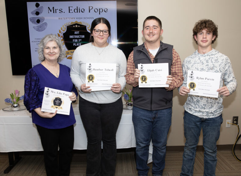 Edie Pope, left, a drama teacher at Watertown High School, poses for a photo with her three students and winners of the Vanderbilt Wilson County Hospital Patient and Family Advisory Council: Wilson County Schools Art Competition, Heather Tidwell, Elijah Cato and Rylan Purvis. (photo by Erin O. Smith)