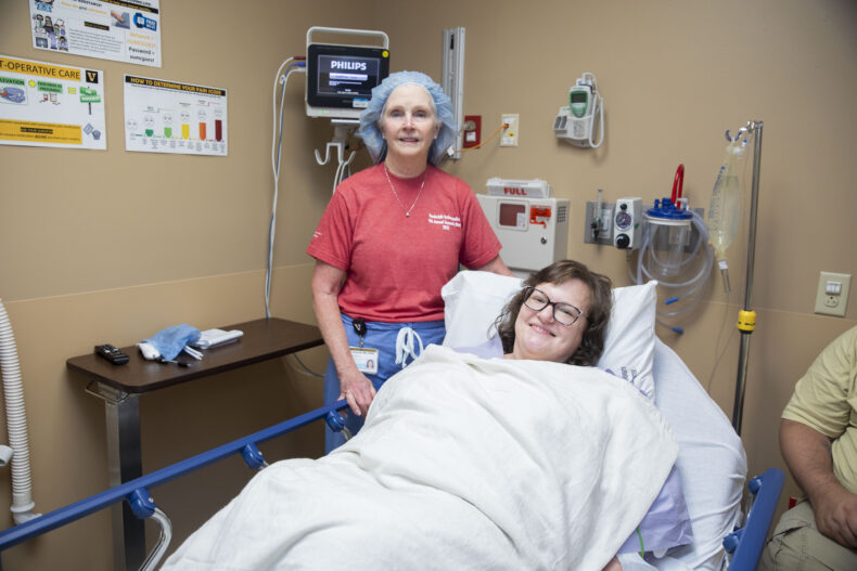 Julie Donovan, RN, CNOR, works with patient Julie Byrd-Jenkins at Orthopaedics Outreach Day. (photo by Susan Urmy)