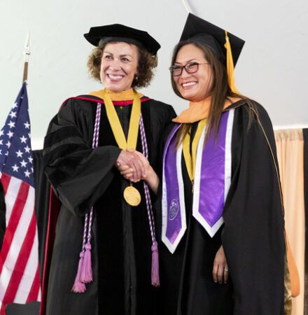 School of Nursing Dean Pamela Jeffries, PhD, RN, congratulates Founder’s Medalist Tip Tilton.