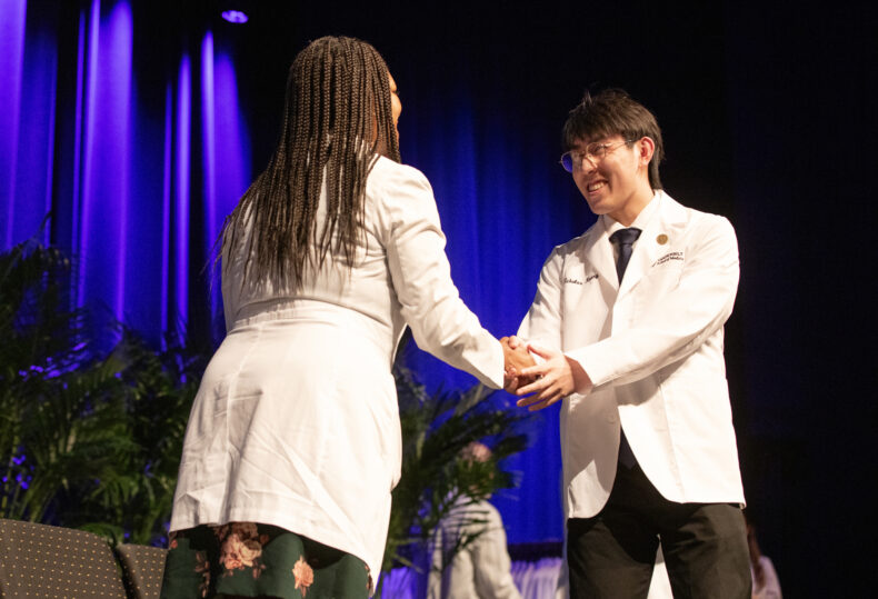Consuelo Wilkins, MD, MSCI, congratulates Nicholas Kuang. (photo by Erin O. Smith)