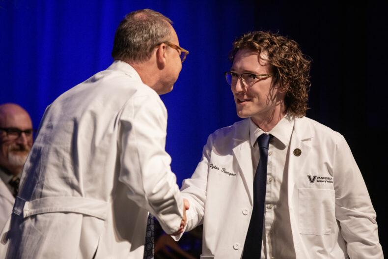Jeff Balser, MD, PhD, congratulates Dylan Keene Thompson. (photo by Erin O. Smith)