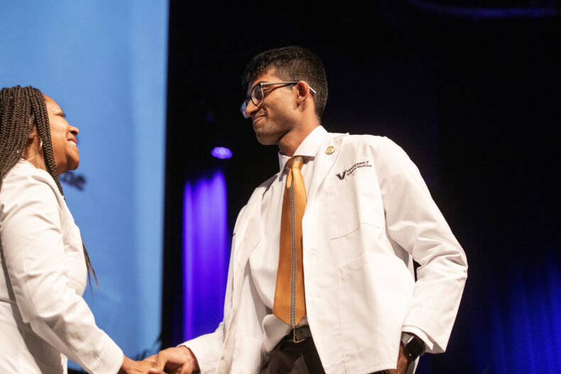 Consuelo Wilkins, MD, MSCI, congratulates Kesavan Venkatesh. (photo by Erin O. Smith)