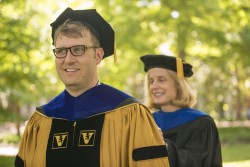 Jennifer Pietenpol, Ph.D., adjusts the doctoral hood of Clayton Marshall, Ph.D., who earned his degree in Biochemistry. (photo by Daniel Dubois)